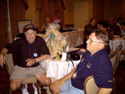 Gene Beaumont and Jack Cistriano.  Linda Beaumont and Mary Camann running 
the shipstore in the background. Elaine, Gene Hopper, and Clint Allen in 
the background.
