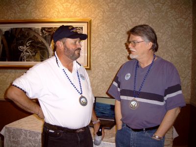 Tom Sieloff and Dean Slone sipping and telling sea stories while at the 
reception.
